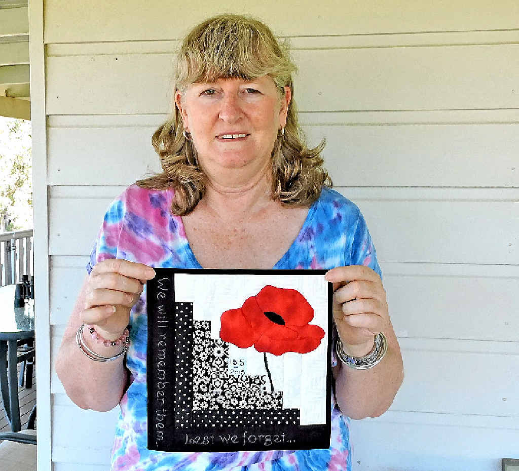 IN STITCHES: Barbara Cutmore holds her winning quilt square from the ACQ’s Lest We Forget quilt challenge. IN STITCHES: Barbara Cutmore holds her winning quilt square from the ACQ’s Lest We Forget quilt challenge.